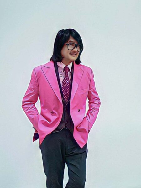 Top Swiss anti-aging pioneer Professor Dato’ Sri Dr. Mike Chan strikes a solitary pose in an electric pink blazer, reflecting the vibrant spirit of MF3 of Switzerland during the Sister's magazine photoshoot in Petaling Jaya on Oct 23, 2024.