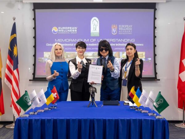 A Historic Moment: The MOU signing between European Wellness Biomedical Group and the Sytenko Institute of Spine and Joint Pathology, marking a new chapter in regenerative medicine, witnessed by doctors at the European Wellness Premier Center in Kota Kinabalu and their online counterparts in Ukraine.